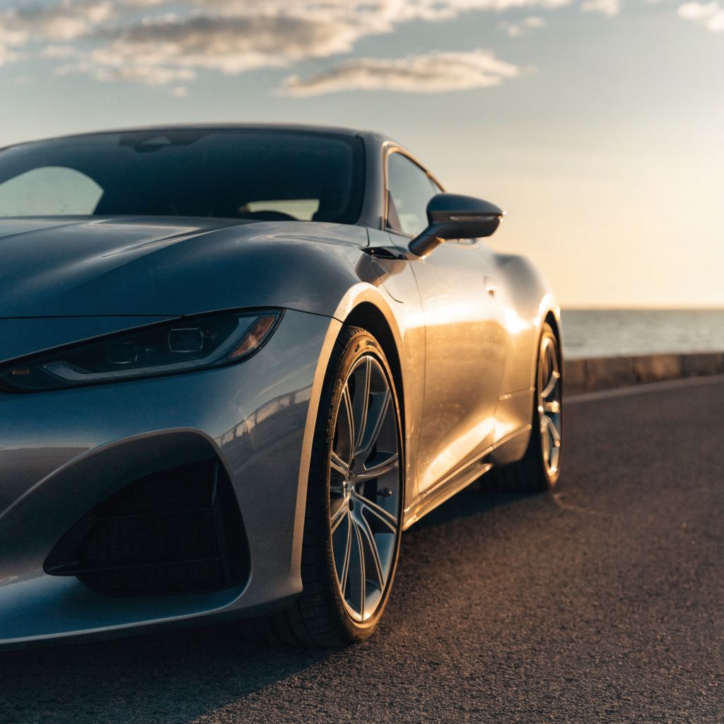 Coupe front quarter at golden hour