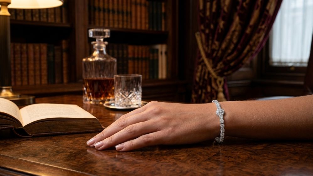 Diamond bracelet on a hand over a book