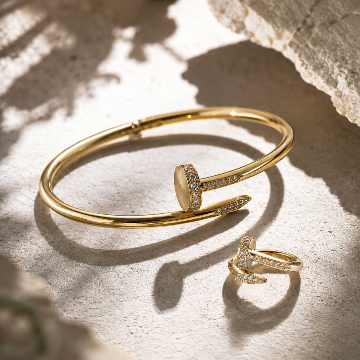 Gold bangle and ring in sunlight