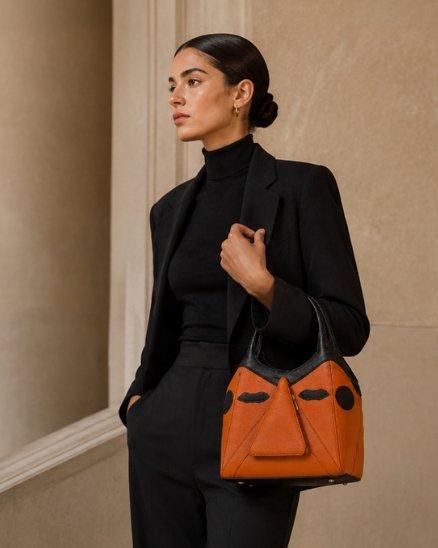 Model with designer handbag